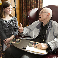 Holonyak converses with a student.